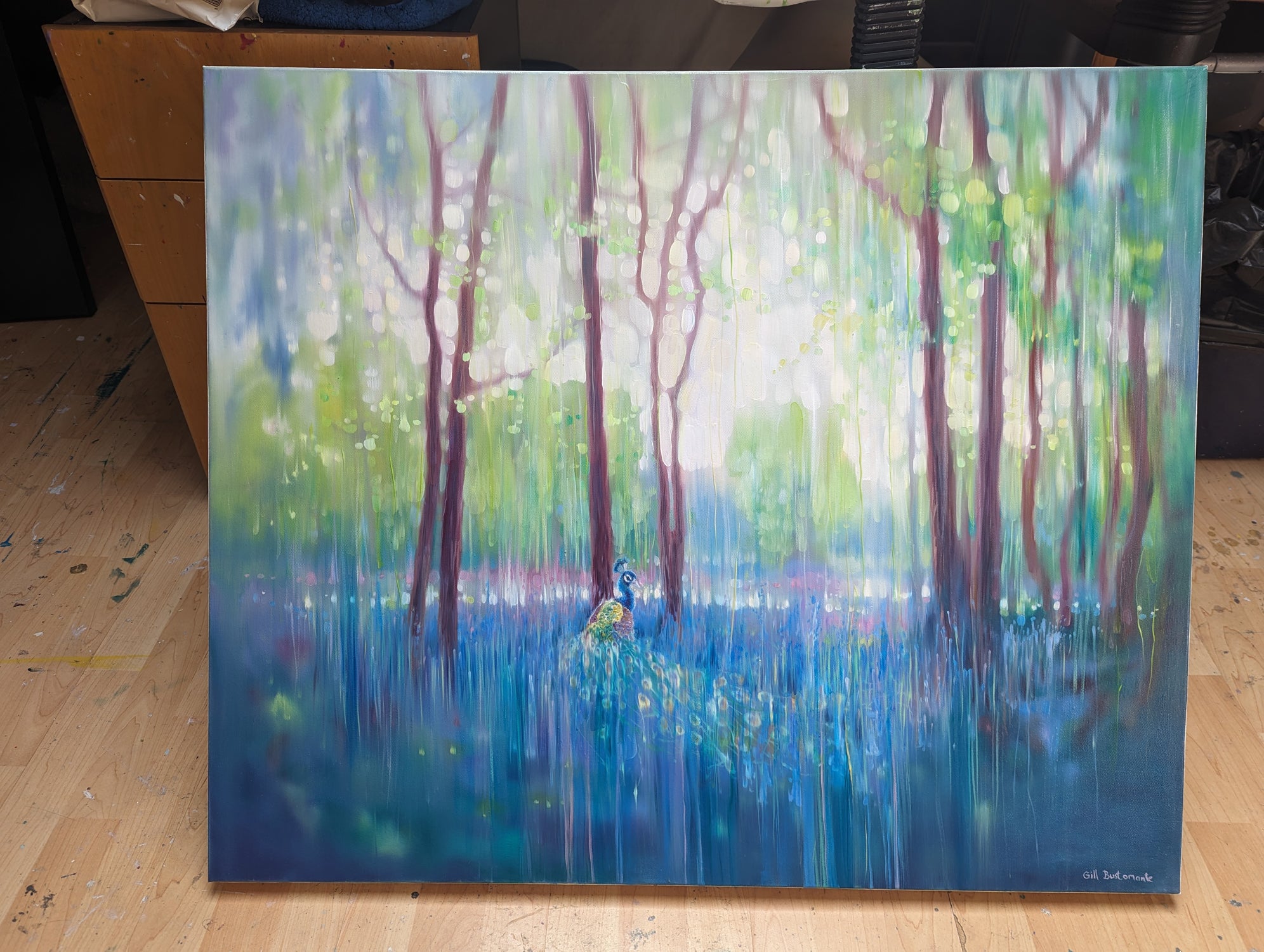 In His Element, a peacock in bluebell landscape painting