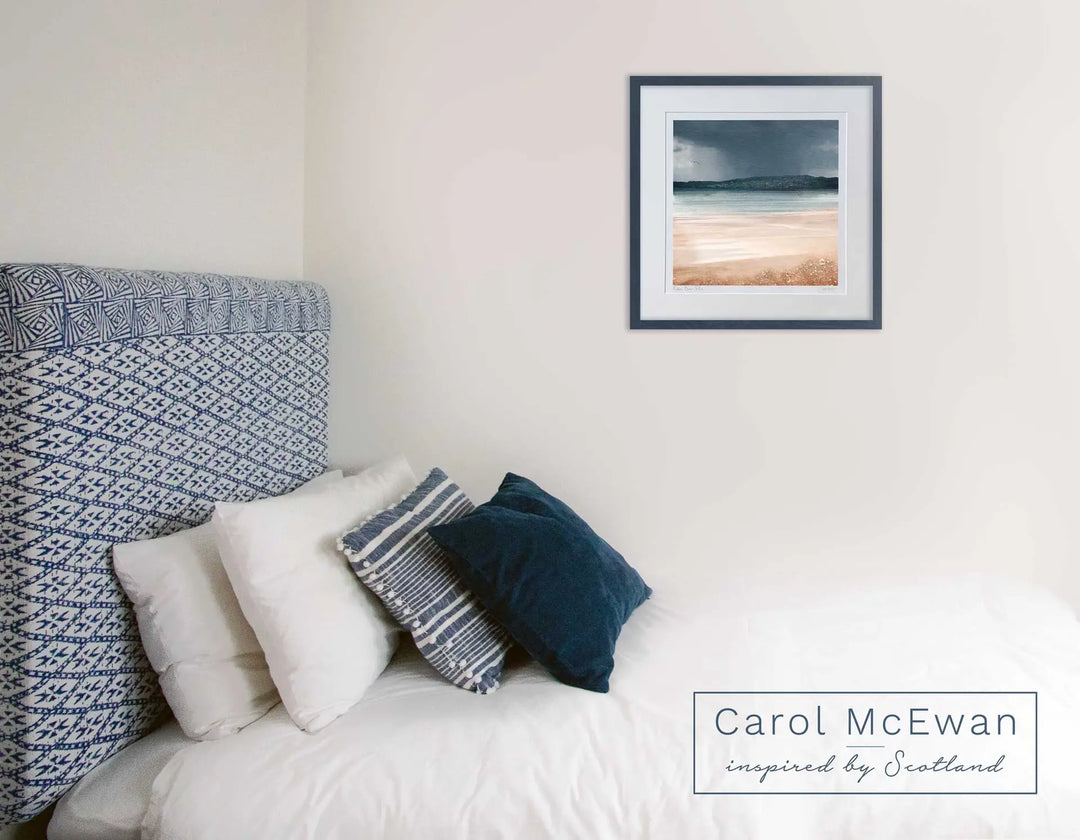 a lovely pale relaxing romo with a Carol McEwan Scottish art print framed on the wall. The frame colour of the beach print matches the bedroom decor.